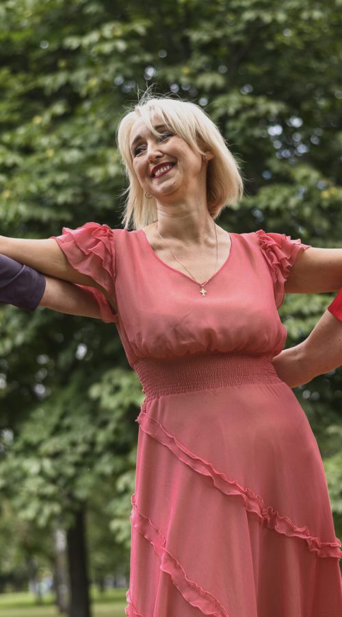Older women joyfully dancing together, celebrating vitality and wellness in the menopause phase.