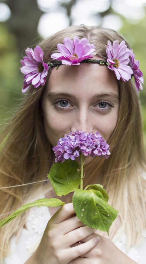 close-up-girl-smelling-flower